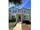 Charming townhome with a covered entryway and well-maintained landscaping in a desirable neighborhood at 12359 Langstaff Dr, Windermere, FL 34786