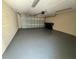 Spacious garage with an epoxy floor and ample storage space at 12359 Langstaff Dr, Windermere, FL 34786