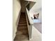 Carpeted staircase leading to the upper level of the home at 12359 Langstaff Dr, Windermere, FL 34786