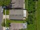 Aerial view of a home showing the roof, backyard, and surrounding green space in a suburban neighborhood at 12938 Maribou Cir, Orlando, FL 32828