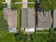 Aerial view of a home showing the roof, backyard, and surrounding green space in a suburban neighborhood at 12938 Maribou Cir, Orlando, FL 32828