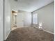 Carpeted bedroom with neutral walls and natural light from a bright window at 12938 Maribou Cir, Orlando, FL 32828
