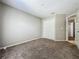 Bedroom with wall to wall carpeting and double closet at 12938 Maribou Cir, Orlando, FL 32828