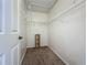 A well-organized closet with wire shelving and carpeted floor at 12938 Maribou Cir, Orlando, FL 32828