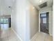 Hallway view with access to the kitchen and bedrooms at 12938 Maribou Cir, Orlando, FL 32828
