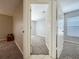 Hallway view of bedroom and access doors to other areas of the house at 12938 Maribou Cir, Orlando, FL 32828
