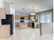 View of the kitchen and bar area with sleek appliances and ample counter space at 12938 Maribou Cir, Orlando, FL 32828