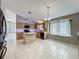 Open kitchen featuring an island and stainless-steel appliances at 12938 Maribou Cir, Orlando, FL 32828