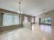 Spacious living room with lots of windows and tile flooring at 12938 Maribou Cir, Orlando, FL 32828
