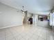 Living room with open view into the kitchen area at 12938 Maribou Cir, Orlando, FL 32828