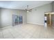 Living room with access to both the lanai and a hallway at 12938 Maribou Cir, Orlando, FL 32828