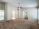 Spacious bedroom with carpet flooring, windows, and a ceiling fan at 12938 Maribou Cir, Orlando, FL 32828