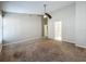 Spacious main bedroom featuring plush carpet, neutral walls and a ceiling fan at 12938 Maribou Cir, Orlando, FL 32828