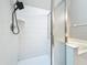 Tiled shower with hand-held fixture and built-in shelf at 12938 Maribou Cir, Orlando, FL 32828