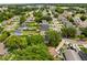This aerial view captures the property's setting within the community, showing the street layout, and nearby homes at 1358 Brookebridge Dr, Orlando, FL 32825