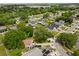 This aerial view displays the property's position with mature trees, along with neighboring houses in the community at 1358 Brookebridge Dr, Orlando, FL 32825