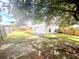 Large backyard featuring a fenced perimeter, small trees, and grass at 1358 Brookebridge Dr, Orlando, FL 32825