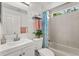 Bright bathroom featuring a shower-tub combo and vanity with modern sink and fixtures at 1358 Brookebridge Dr, Orlando, FL 32825
