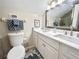 Bathroom featuring dual sinks, a large mirror, and modern fixtures at 1358 Brookebridge Dr, Orlando, FL 32825