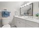 Bright bathroom featuring dual sinks, a large mirror, and modern fixtures at 1358 Brookebridge Dr, Orlando, FL 32825