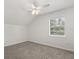 This is a simple bedroom with a ceiling fan, a window, and neutral carpet at 1358 Brookebridge Dr, Orlando, FL 32825