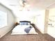 Bedroom featuring a ceiling fan, carpeted floors, and a comfortable bed setup at 1358 Brookebridge Dr, Orlando, FL 32825