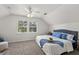 Bright bedroom featuring a cozy bed with blue accents and natural light from the window at 1358 Brookebridge Dr, Orlando, FL 32825