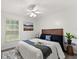 Cozy bedroom with bright ceiling fan and comfortable bedding with stylish accents at 1358 Brookebridge Dr, Orlando, FL 32825
