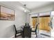 Cozy dining area with black table, chairs and sliding door to the outside patio at 1358 Brookebridge Dr, Orlando, FL 32825