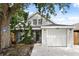 Charming home featuring grey siding, a one-car garage and mature trees for shade at 1358 Brookebridge Dr, Orlando, FL 32825