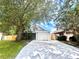 A charming home with a well-maintained lawn, long driveway, and a one-car garage at 1358 Brookebridge Dr, Orlando, FL 32825