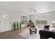 Open living room with wood-look floors, lots of light and comfortable seating at 1358 Brookebridge Dr, Orlando, FL 32825