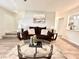 Bright living room with wood-look floors, ceiling fan and comfortable seating at 1358 Brookebridge Dr, Orlando, FL 32825