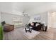 Bright living room with wood-look floors, ceiling fan and lots of natural light at 1358 Brookebridge Dr, Orlando, FL 32825