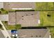 Aerial view of roofs and well-manicured lawns of modern homes, creating a neat and aesthetically pleasing streetscape at 1409 Bellamy Dr, Reunion, FL 34747