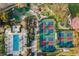 Aerial view of the resort featuring a pool, pickleball courts, playground and putting green at 1409 Bellamy Dr, Reunion, FL 34747
