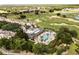 Scenic aerial view of a resort, highlighting the pool, golf course, and surrounding residences at 1409 Bellamy Dr, Reunion, FL 34747