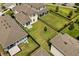 A large, well-maintained backyard featuring a black metal fence and lush green grass, offering ample space for outdoor activities at 1409 Bellamy Dr, Reunion, FL 34747