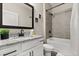 This bathroom features a granite vanity and a shower-tub combination, providing a clean and functional space at 1409 Bellamy Dr, Reunion, FL 34747