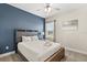 Charming bedroom with a queen bed, large window, and stylish decor, creating a peaceful and inviting atmosphere at 1409 Bellamy Dr, Reunion, FL 34747