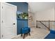 Open loft area with plush carpeting, a mounted TV, and stylish furnishings create a cozy and inviting space at 1409 Bellamy Dr, Reunion, FL 34747