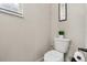 Small powder room including a toilet with a green potted plant placed on the tank and roll of toilet paper at 1409 Bellamy Dr, Reunion, FL 34747