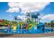 Community water park featuring multiple slides and play areas for splashing and fun on a beautiful day at 1409 Bellamy Dr, Reunion, FL 34747