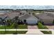 Charming single-Gathering home in a quiet neighborhood with lush landscaping and manicured lawn at 165 Lavenna Ave, St Cloud, FL 34771