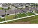 Fenced backyard with lawn and garden, offering a private outdoor space for relaxation and gardening at 165 Lavenna Ave, St Cloud, FL 34771