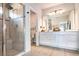 Bathroom with a glass-enclosed shower, double vanity, and contemporary fixtures at 165 Lavenna Ave, St Cloud, FL 34771