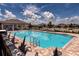 Sparkling community pool with lounge chairs and shade, perfect for relaxing and enjoying the summer weather at 165 Lavenna Ave, St Cloud, FL 34771