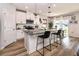 Kitchen island with granite countertops, seating, and stainless steel appliances at 165 Lavenna Ave, St Cloud, FL 34771
