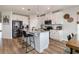 Bright kitchen with granite countertops, stainless steel appliances, and ample counter space at 165 Lavenna Ave, St Cloud, FL 34771