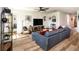 Cozy living room with stylish furnishings, wood-look flooring, and natural light at 165 Lavenna Ave, St Cloud, FL 34771